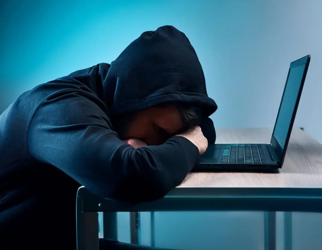 Programmer sleeping on his laptop